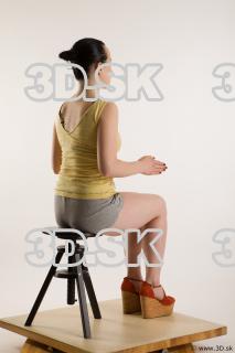 Sitting reference of whole body yellow t shirt gray shorts…